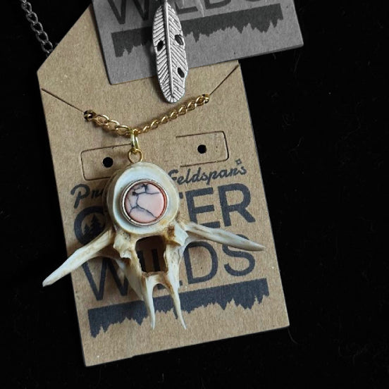 Necklace with bone fish pendant on a branded card